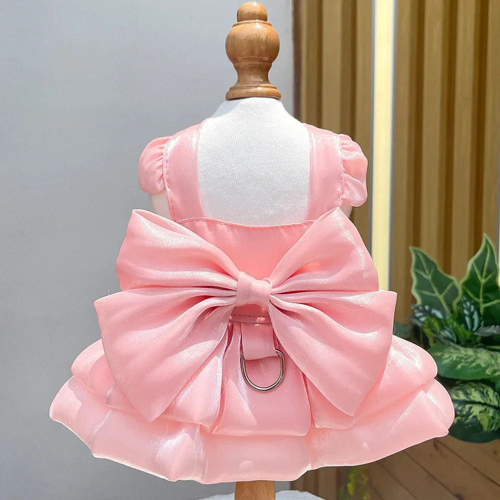 Pink satin pet dress for a small dog with a D-ring attached