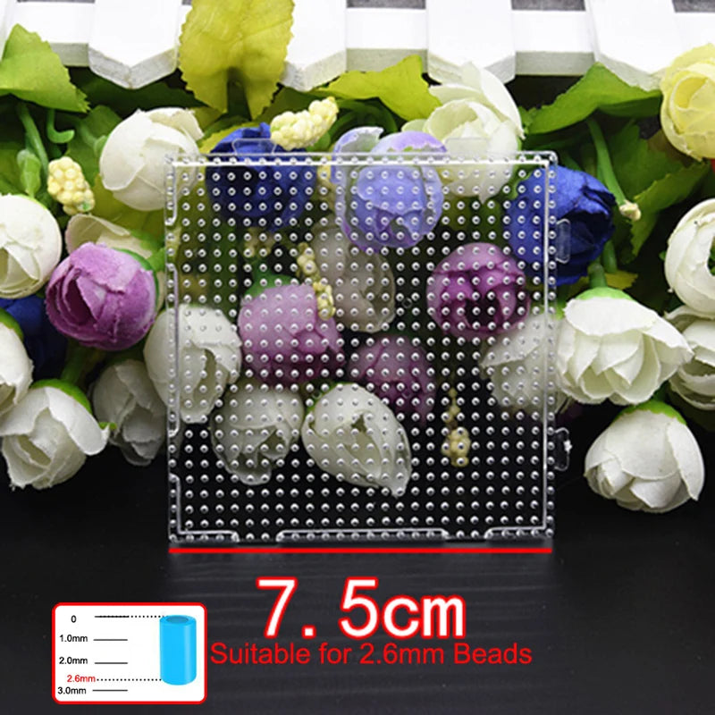 A precision hama beads tweezers kit showing various colored plastic beads and a grid for sorting.