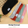 A collection of knitted winter sweaters for dogs and cats in various pastel and earthy tones laid out on a light background.