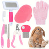Multitooles-Pflegekit für Haustiere mit rosa Bürste, Silikonpad, Schere und einem kleinen Kaninchen.
