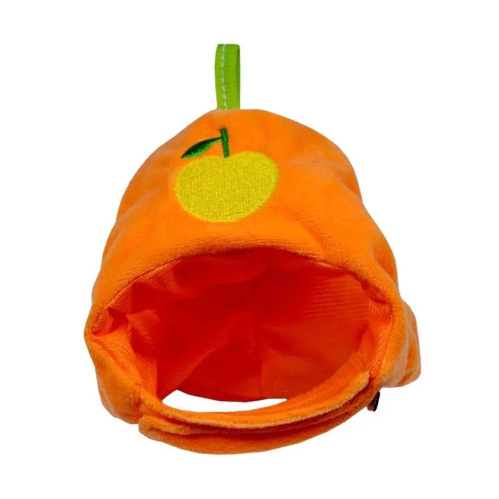 An orange fruit-shaped pet hat for cats and dogs with a green stem