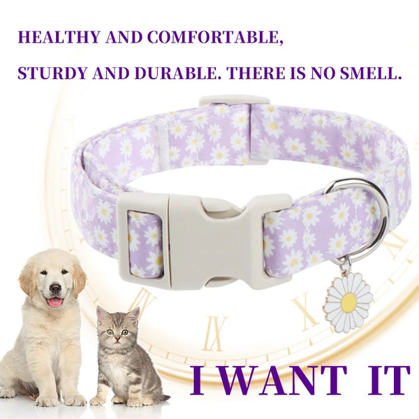 A white nylon flower dog collar is shown with a silver clasp and a paw print on a light-colored background.