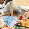 A yellow pet sniffing mat with various fabric toys and feeding items for dog training