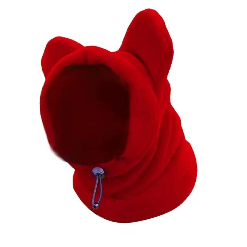 A bright red fleece dog winter hat with a hood and drawstring detail.