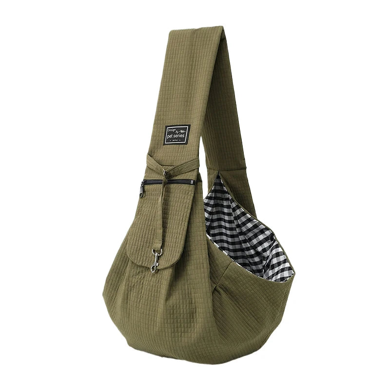 Olive green crossbody pet carrier bag with a black and white plaid fabric lining
