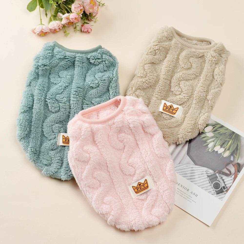 Three cozy fleece pullover sweatshirts for pets in mint green, beige, and pink.