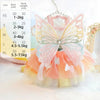 A colorful rainbow butterfly pet dress for cats and dogs displayed with size chart options.