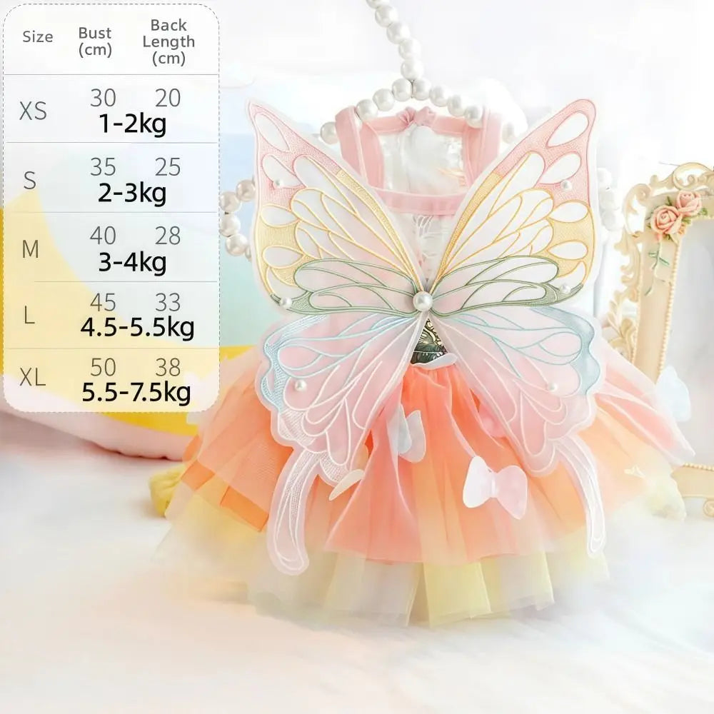 A colorful rainbow butterfly pet dress for cats and dogs displayed with size chart options.