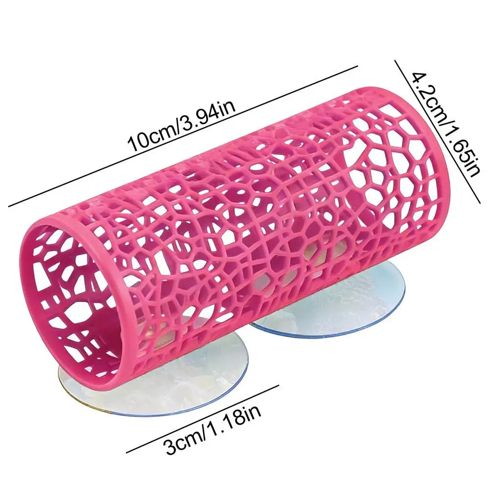 Pink aquarium hideout tube with a honeycomb mesh and suction cups for betta fish