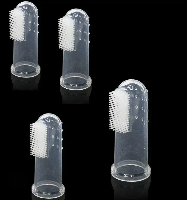 Four silicone finger toothbrushes for dogs shown in various orientations and angles.