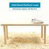 A large solid wood platform for hamsters is shown on a light wooden table.