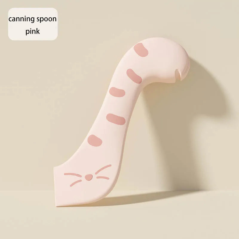 Pink silicone canning spoon shaped like a cat with whiskers