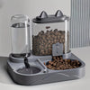 Grauer Napf für Haustiere mit klarem Behälter für Futter und Wasser und separatem Futtertray.