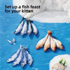 Fish feast for a kitten featuring various types of fish laid out on a blue surface.