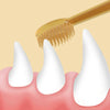 A golden silicone pet toothbrush is shown brushing a white tooth on a pink tongue.