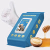 Box of pet glove wipes with a white cleaning glove and a piece of honey