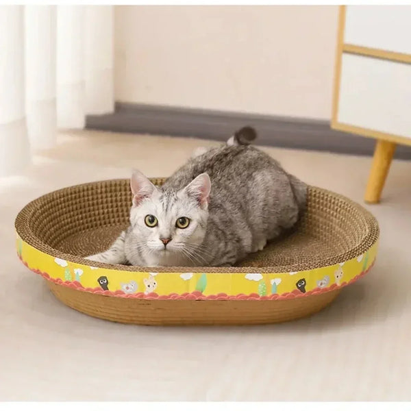 A gray cat is resting in a round, woven scratching post with yellow trim on a light surface.