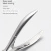 A close-up view of a stainless steel cuticle nipper tool used for manicuring.