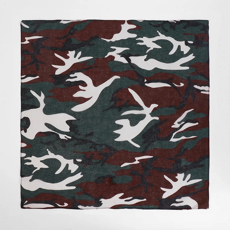A close-up of a dark green and brown camouflage print cotton bandana.