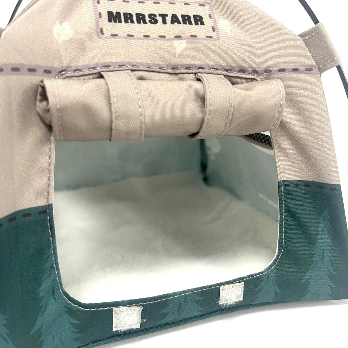 A beige breathable mesh foldable pet tent with a rectangular opening and a name tag labeled MRSTARR.