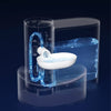 A transparent automatic pet drinking water dispenser with a white bowl and blue glowing tubing is shown on a dark surface.