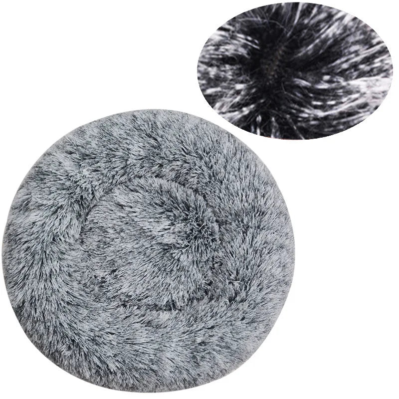 A round, gray plush pet bed with a textured cover shown in two views.