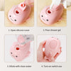 A pink electric pet grooming brush with a silicone cover being prepared for use, showing steps to open, pour gel, dilute with