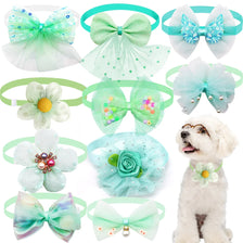 A collection of lace bow tie collar accessories for small dogs and cats in various shades of green, blue, and white.