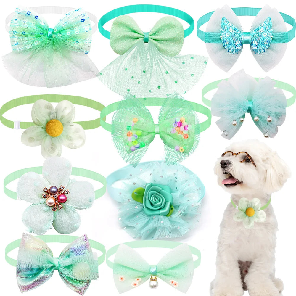 A collection of lace bow tie collar accessories for small dogs and cats in various shades of green, blue, and white.