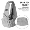 A gray pet carrier sling bag for dogs and cats shown folded and a separate hat-like item.