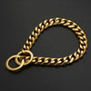 A gold stainless steel Cuban link training collar for a dog, shown against a dark background.