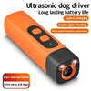 Orange ultrasonic dog driver with a black body and a light-emitting nozzle.