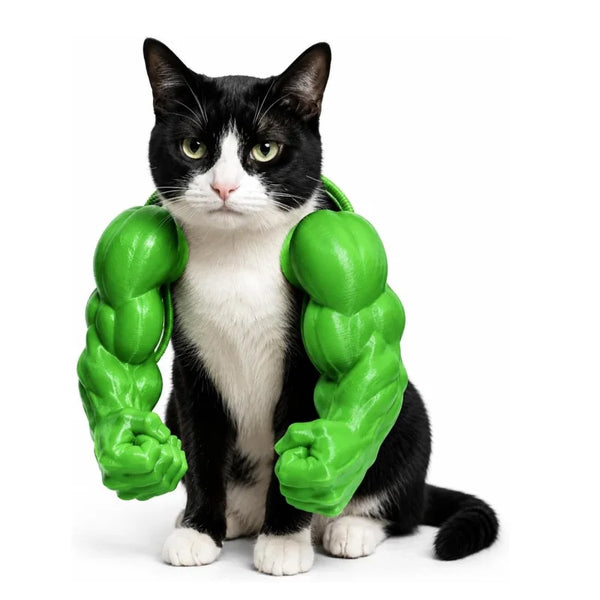 A black and white cat wearing a green 3D printed muscle costume.