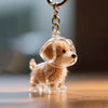 Una pequeña figura de perro de color marrón claro con almacenamiento de pelo transparente, adjunta a un llavero plateado.