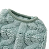 A close-up of a light blue fuzzy fleece dog sweater with a ribbed collar.
