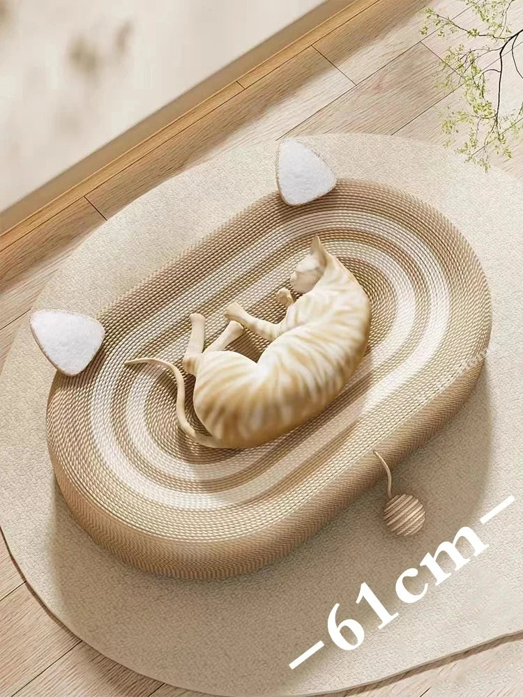 A light beige sisal board with concentric grooves features a small cream-colored cat lying on it, accompanied by white chew t