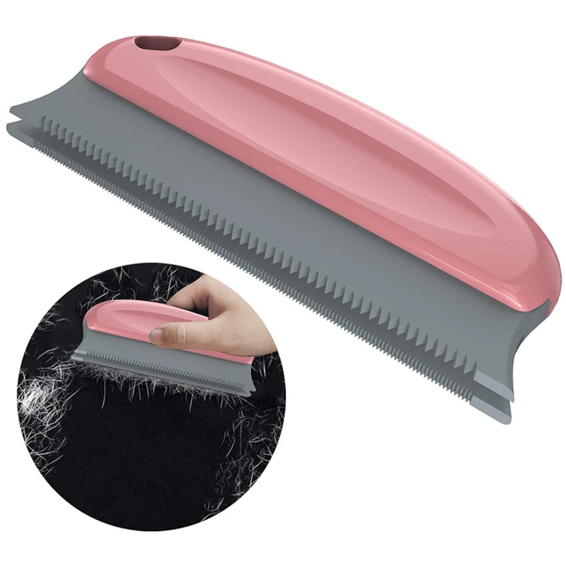 A pink and gray portable lint and pet hair remover brush shown in a diagonal view with a close-up of the bristles.