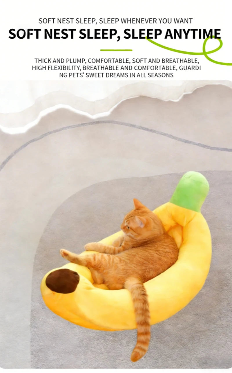 A fluffy orange cat is relaxing in a yellow, banana-shaped plush pet bed.