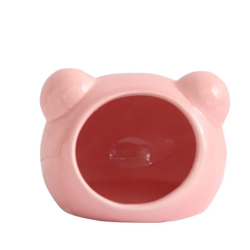 Pink ceramic hamster house with a cooling design featuring rounded ears.