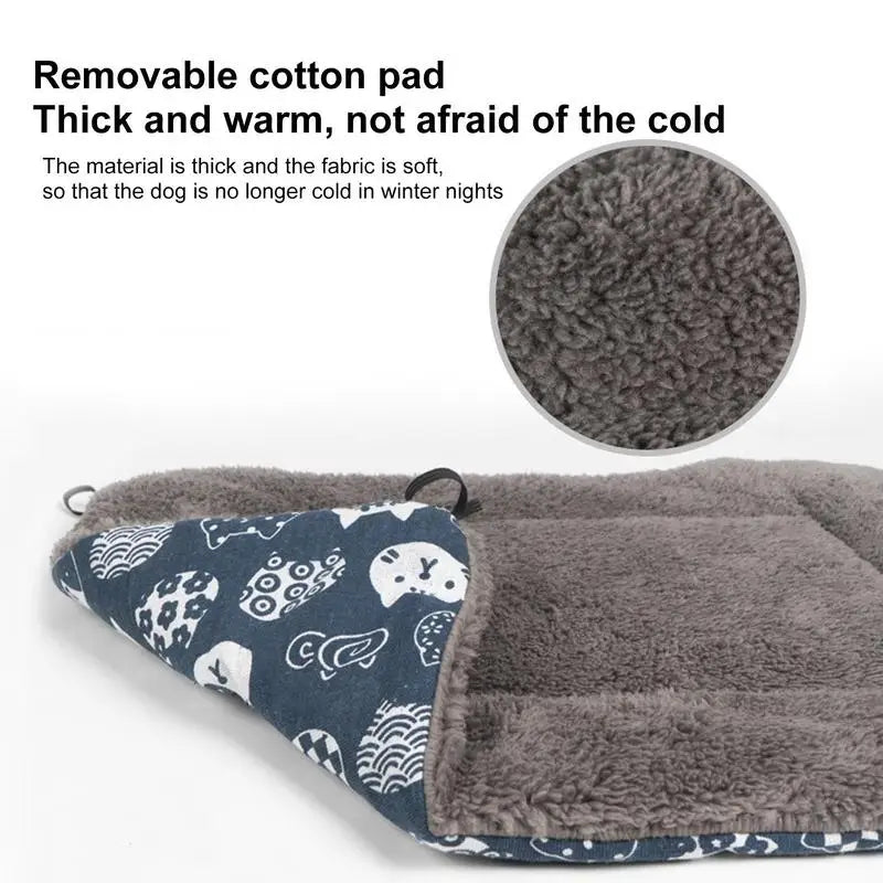 A portable elevated dog cot with a removable shade canopy featuring a soft, thick, gray faux fur mat and a patterned fabric i