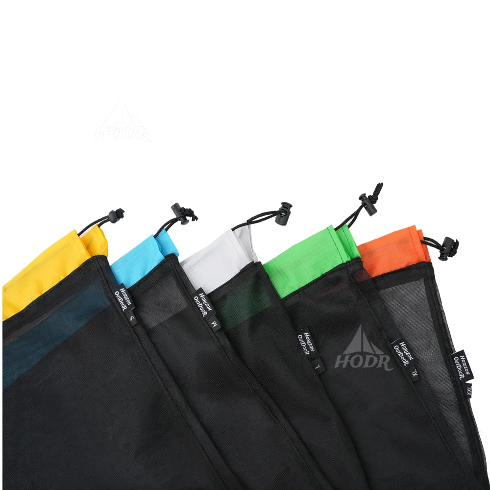 A collection of ultralight mesh storage bags in various colors including yellow, blue, white, green, and orange.