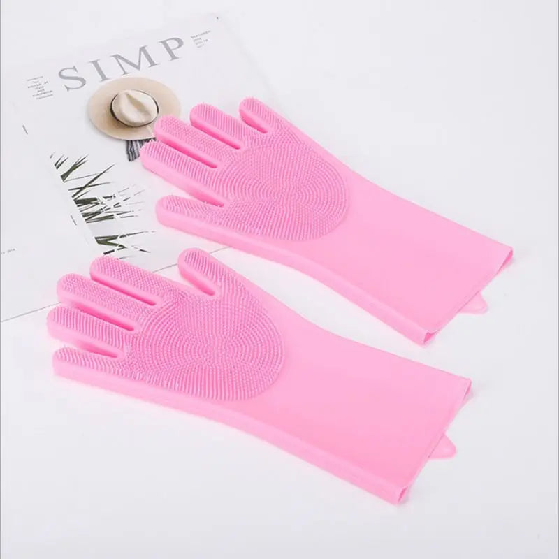 Pink silicone pet grooming gloves for dogs and cats shown on a white background.