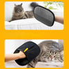 A cat is being groomed with a black double-sided pet grooming glove.