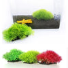Vibrant artificial green and red aquatic plants used for fish tank decoration