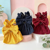 A vintage corduroy pet dress in yellow features a large bow and ruffle skirt displayed on a white surface.