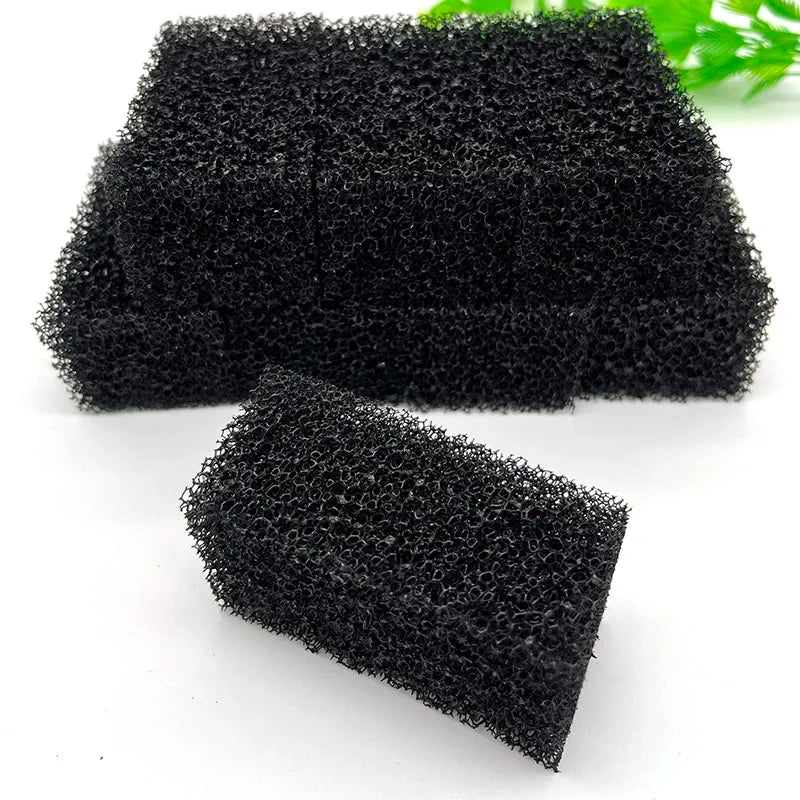 Two pieces of black aquarium bio sponge filter media are shown on a white background.