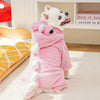 A pink cozy fleece dog hoodie with animal ears lying on a light-colored floor.