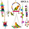 Eight pieces of natural wooden swing and chewing toys for parrots, including a hanging ring and various colored blocks.