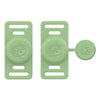 A pair of light green silicone airtag holders designed to clip onto pet collars.