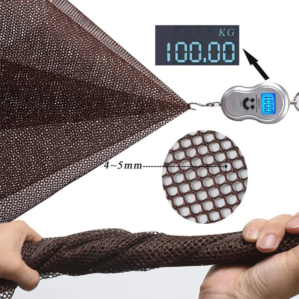 A close-up view of a dark brown safety net material being held, with a digital scale showing 100.00 kg.